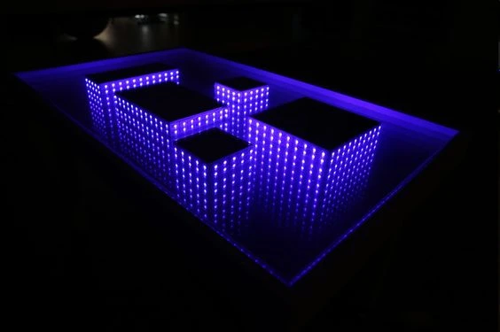 Centro de mesa acrilico grabado en laser con luces led rgb para decoración.